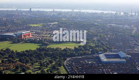 aerial view of Liverpool FC's Anfield Stadium and Everton FC's Goodison Park Stadium looking towards the city centre skyline and Mersey Estuary Stock Photo