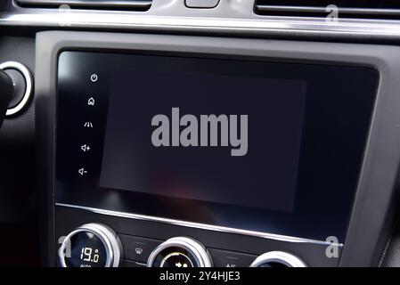 Screen multimedia system on dashboard in a modern car Stock Photo