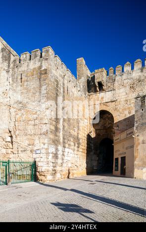 Carmona, Spain, Jan 8 2009, Discover the ancient Sevilla gate in Carmona, a stunning example of Moorish architecture against a clear blue sky. Stock Photo