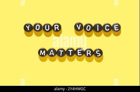 Inspiring quote your voice matters in black and white beads on vibrant yellow background for empowerment concept. Stock Photo