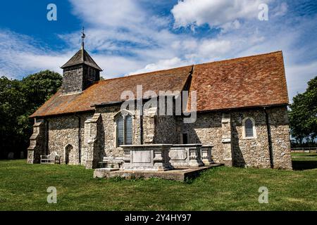 The Church of St Thomas the Apostle on the bank of the River Swale in Harty on the Isle of Sheppey in the county of Kent, United kingdom. Grade II. Stock Photo