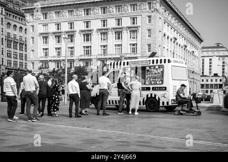 Ice cream truck and customers at the Albert dock Stock Photo