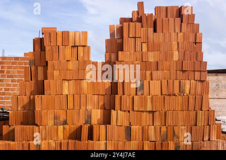 Brazilian clay bricks piled on a home construction site in Brazil Stock Photo