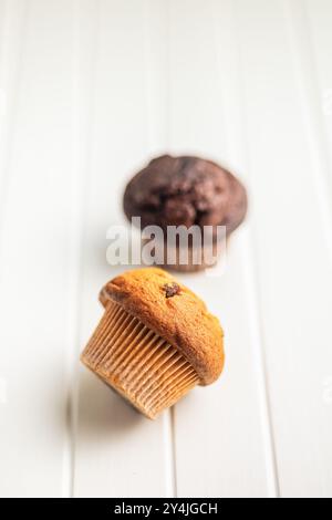 Sweet muffin cakes on a white table. Stock Photo