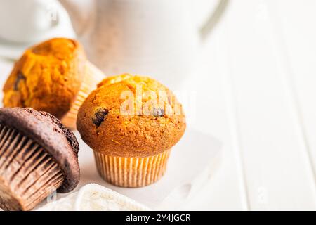 Sweet muffin cakes on a white table. Stock Photo