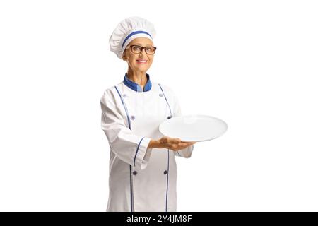 Female chef holding an empty plate isolated on white background Stock Photo