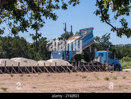 Georgetown, TX - September 9, 2024: Timber frame for the concrete slab of a single family home with sand being delivered as base of foundation slab. Stock Photo