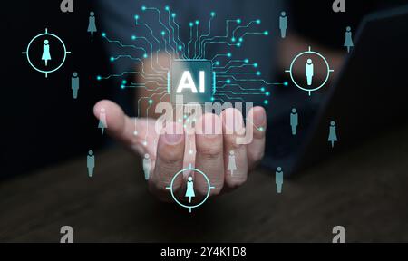 AI technology for HR, Human resources. A man uses artificial intelligence to manage and recruit employees. Automate the hiring process Stock Photo