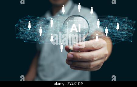 AI technology for HR, Human resources. A man holds lightbulb with artificial intelligence chip in it representing using Ai and automation to manage an Stock Photo