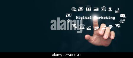 Digital marketing concept. Hand taps on the text, digital marketing, surrounded with online marketing icons through social media, email, website and o Stock Photo