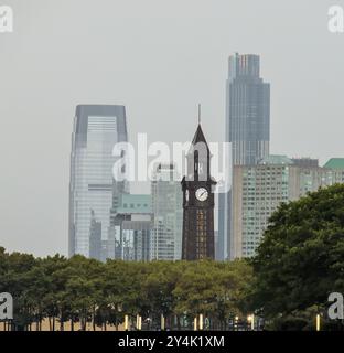 lackawanna eerie station clock tower at hoboken new jersey with jersey city skyline skycrapers in the background Stock Photo