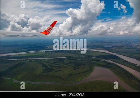 GOL airplane wing and the Jacui, Gravatai and Guaiba rivers (lake) and the islands in Porto Alegre, Rio Grande do Sul, Brazil. Stock Photo