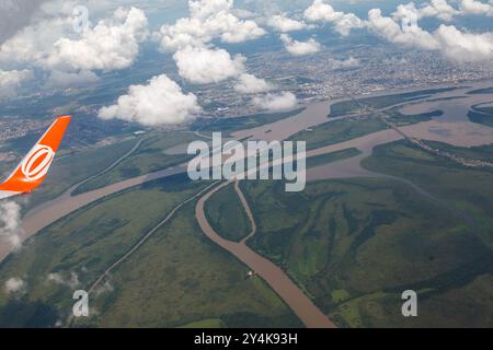 GOL airplane wing and the Jacui, Gravatai and Guaiba rivers (lake) and the islands in Porto Alegre, Rio Grande do Sul, Brazil. Stock Photo