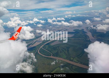 GOL airplane wing and the Jacui, Gravatai and Guaiba rivers (lake) and the islands in Porto Alegre, Rio Grande do Sul, Brazil. Stock Photo