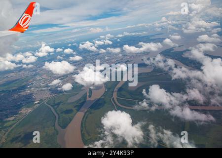 GOL airplane wing and the Jacui, Gravatai and Guaiba rivers (lake) and the islands in Porto Alegre, Rio Grande do Sul, Brazil. Stock Photo