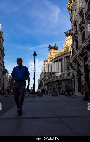 Daily life as dusk falls near Plaza del Sol in Madrid, Spain. Stock Photo