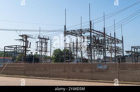An electrical power substation behind a chain link fence in Warren, Pennsylvania, USA Stock Photo