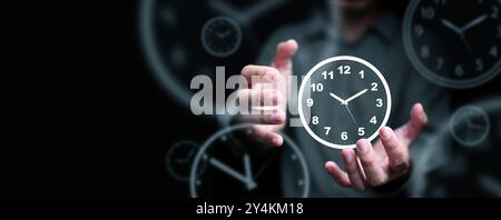 Time management concept. Man with clock in his hands representing his control and planning his life, business, work for productivity using technology Stock Photo