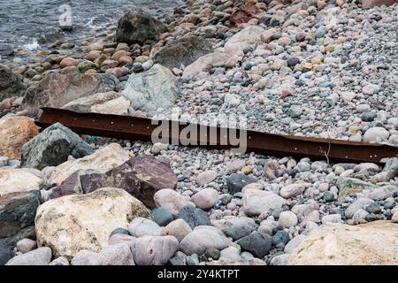 Concrete and steel support remains from the defunct railway bridge in Seal Cove, Conception Bay South, Newfoundland & Labrador, Canada Stock Photo