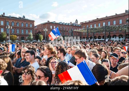 The audience with a young boy holding red, white and blue flags in the center. Ceremony welcoming the athletes of Paris 2024. Toulouse Mayor Jean-Luc Moudenc welcomes the athletes and para-athletes from Toulouse and the metropolitan area who took part in the Paris 2024 Games. Among those announced are five-time medal-winning swimmer Leon Marchand, golden rugby players Antoine Dupont and Nelson Epee, double-medal-winning Paralympic swimmer Ugo Didier, silver boxers Sofiane Oumiha and Billal Bennama, TFC goalkeeper Guillaume Restes, vice-Olympic champion, and para-long jumper Dimitri Pavade. Fra Stock Photo