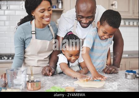Cookies, baking and black family in kitchen for bonding, learning and skill development in home. Dough, ingredients and African parents teaching Stock Photo