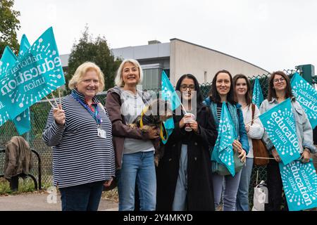 Slough, UK. 19th September, 2024. NEU members from Baylis Court School stand on a picket line on the first day of a strike over a medical absence policy at two Thames Learning Trust schools. Currently, the leave of absence policy at Baylis Court School and Reading Girls School does not permit members of staff to receive paid time off to attend medical appointments or to accompany dependents to attend such appointments. Strikes over the issue at both schools, for which members voted 100% in favour on a turnout of 78%, are scheduled for 19th and 24th-25th September and 1st-3rd October. Credit: M Stock Photo