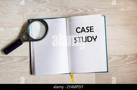 Card with case study text on a white background with office items. Business concept. Stock Photo