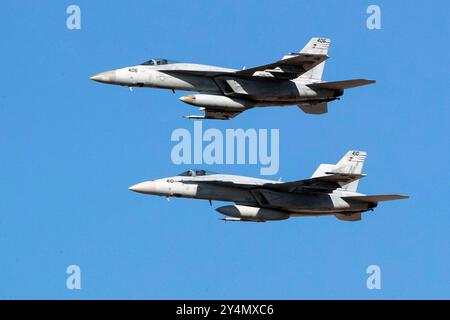 240829-N-FR705-1238 NAVAL AIR STATION FALLON, Nev. (Aug. 29, 2024) – Two F/A-18E Super Hornets assigned to Strike Fighter Squadron (VFA) 146 fly durin Stock Photo