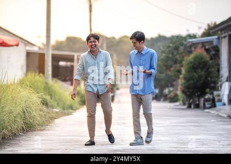 Young businessman discussing for their business. Happy young executive having discussion for next project. Two male business partner talk each other. Stock Photo