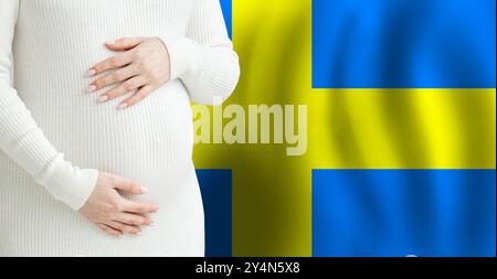 Pregnant woman belly against Swedish flag background. Demographics and pregnancy in Sweden concept Stock Photo