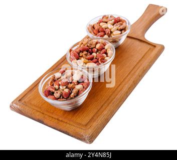 Assorted nuts in a glass bowls on wooden Stock Photo