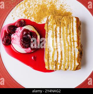 Napoleon cake with vanilla ice cream with cherry jam Stock Photo