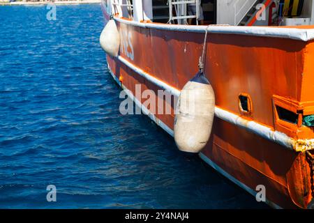 buoy hanging outside the hull of the boat, boat equipment, safety at sea Stock Photo