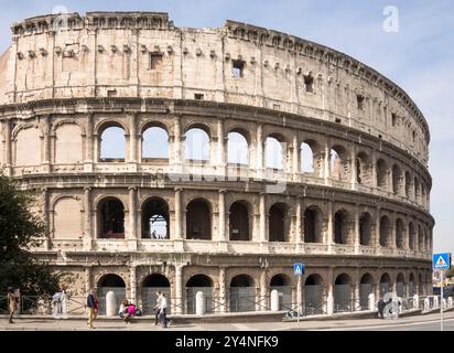 Rome, Italy- April 02, 2014:Tourists visiting the Coliseum (started to build in 72 AD under Vespasian, and in 80 AD amphitheater was consecrated by Ti Stock Photo