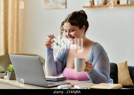 Merry plus size woman with curly hair in cozy attire working at home. Stock Photo