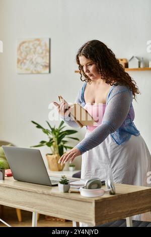 Pretty woman with curly hair and comfy vibrant attire at home. Stock Photo