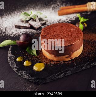 Mango and chocolate mousse on wooden black Stock Photo