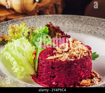 Warm beetroot, nuts and herbs salad Stock Photo