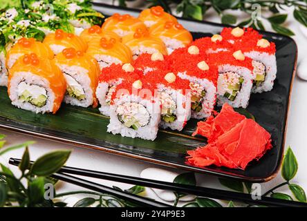 Big set of rolls with wasabi and pickled ginger Stock Photo