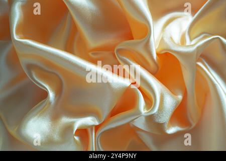 background and texture of silk fabric in peach color Stock Photo