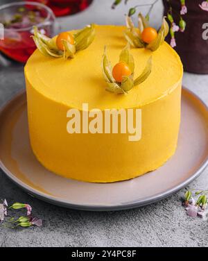 Tasty mango mousse cake on plate Stock Photo