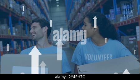 Image of digital data processing over diverse volunteers working in warehouse Stock Photo