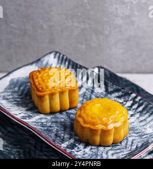 two chinese cakes on traditional plates Stock Photo