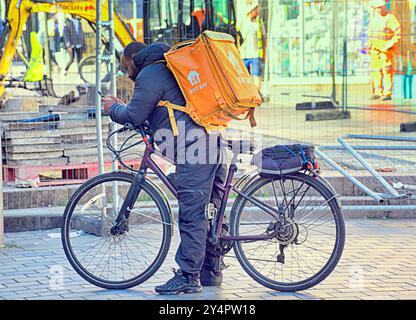 Glasgow, Scotland, UK.19th September, 2024. UK Weather:  Sunny and warm as summer returns. A fast food deliverer on the disaster that is sauchiehall street. Credit Gerard Ferry/Alamy Live News Stock Photo