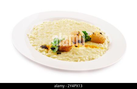 Scallops in sauce and white rice in a plate Stock Photo