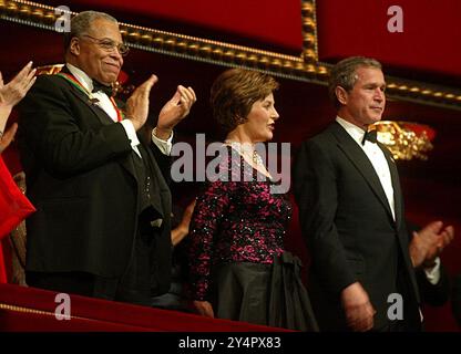 United States President George W. Bush (R) and First Lady Laura Bush (2nd R) attend an honor gala with actor James Earl Jones, one of the recipients of the 2002 Kennedy Center Honors December 8, 2002 at the Kennedy Center in Washington, DC. The Kennedy Center honored the recipients of the 2002 Kennedy Center Honors for their contributions to the cultural life of the nation.Credit: Alex Wong/Pool via CNP Stock Photo