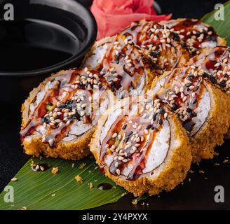 Warm sushi roll with unagi sauce Stock Photo