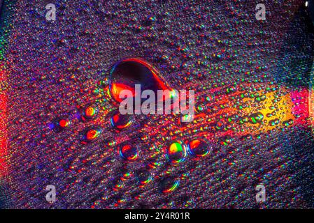 Macro photo of an oil drops on water surface Stock Photo - Alamy