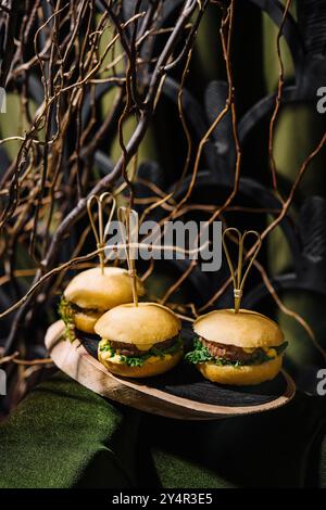 three mini burgers in the forest Stock Photo