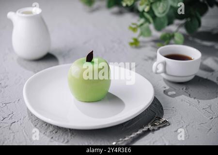 apple shaped mousse cake and tea Stock Photo